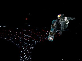 Canada's Mark McMorris performs a jump on his way to third place at a men's World Cup snowboard race in Rho, Italy on Nov. 12.