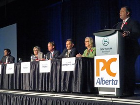 Former Conservative MP Jason Kenney, right, speaks to 1,100 members in the first Alberta Progressive Conservative party leadership forum while the other five leadership candidates  listen. Left to right: Stephen Khan, Sandra Jansen, Byron Nelson, Richard Starke and Donna Kennedy Glansin in Red Deer, Alta. on Nov. 5, 2016.