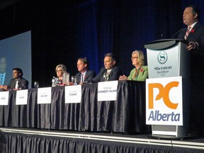 Former Conservative MP Jason Kenney speaks to 1,100 members in the first Alberta Progressive Conservative party leadership forum while the other five leadership candidates, Stephen Khan, left to right, Sandra Jansen, Byron Nelson, Richard Starke and Donna Kennedy Glans listen in Red Deer, Alta. Saturday.