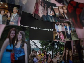Photographs of friends and family and a note saying "It's better to feel pain, than nothing at all" on display in the bedroom belonging to 18 year-old Laura Tardif at the family home in Riviere-du-Loup.