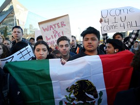 Students carrying the Mexican flag protest against president-elect Donald Trump in Minneapolis on Nov. 11, 2016.