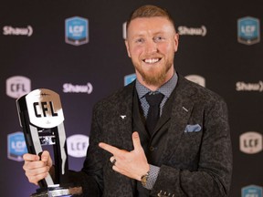 Quarterback Bo Levi Mitchell of the Calgary Stampeders holds up the award as the most outstanding player in the CFL during Thursday's annual CFL Awards Dinner in Toronto. Mitchell will lead the Stampeders into Sunday's Grey Cup Game against the Ottawa Redblacks at BMO Field in Toronto.