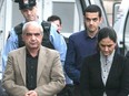 Mohammad Shafia, front left, his wife Tooba Mahommad Yahya, front right, and their son Hamed Shafia, back, arrive in Frontenac County Court in Kingston, Ont. on Oct. 20, 2011.