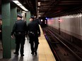 New York City police patrol a subway station in Times Square on Nov. 7, 2016.