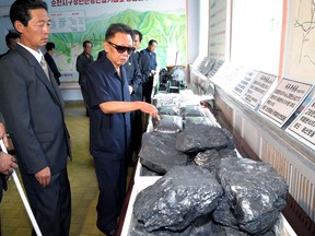 This undated handout picture, released from North Korea's official Korean Central News Agency on August 18, 2009 shows North Korean leader Kim Jong Il inspecting the Jikdong Youth Coal Mine.