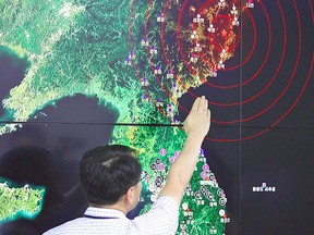 A South Korean official points to a map showing the epicenter seismic waves in North Korea, at the Korea Meteorological Administration in Seoul on Sept. 9, 2016 following news of a nuclear test by North Korea.