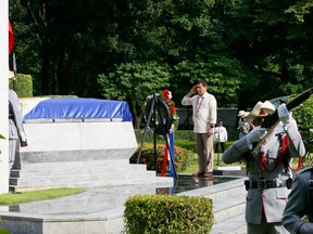 In this Aug.29, 2016 file photo, Philippine President Rodrigo Duterte salutes at the Tomb-of-the-Unknown-Soldier during wreath-laying ceremony in observance of National Heroes Day Monday, Aug. 29, 2016 at the Heroes Cemetery in suburban Taguig city east of Manila, Philippines.