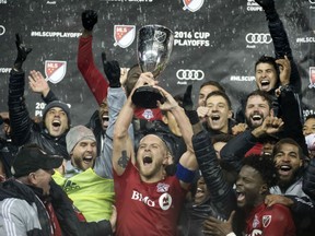 Toronto FC captain Michael Bradley celebrates with his teammates after outlasting the Montreal Impact 5-2 in extra time to win the MLS Eastern Conference championship at Toronto's BMO Field on Wednesday night.
