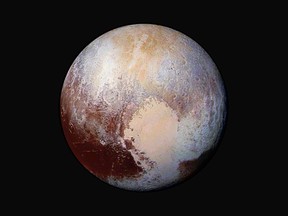 This image made available by NASA on July 24, 2015 shows a combination of images captured by the New Horizons spacecraft with enhanced colours to show differences in the composition and texture of Pluto's surface