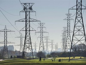 Hydro towers are seen over a golf course in Toronto in a 2015 file photo.