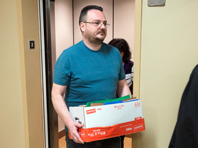 Jean-Claude Savoie arrives at court in Campbellton, N.B., on Tuesday, Nov. 1, 2016. He is charged with criminal negligence causing death after two young brothers, Connor and Noah Barthe, were killed by a python in August 2013