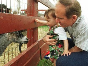 Dave Rogers and son Cameron visit the Valleyview Little Animal Farm.