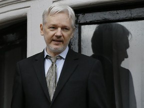 In this Feb. 5n photo, WikiLeaks founder Julian Assange speaks from the balcony of the Ecuadorean Embassy in London. Assange will be interviewed about Swedish sex crime allegations at the Ecuadorean Embassy in London on Monday, Nov. 14.