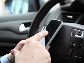 Simply holding a cellphone in a car in Saskatchewan could be enough to net you a $280 fine under a new law.