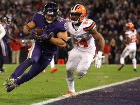 Fullback Kyle Juszczyk of the Baltimore Ravens bulls his way into the end zone ahead of Cleveland Browns defender Ibraheim Campbell during the Thursday night NFL game in Baltimore. The Ravens were 28-7 winners to improve to 5-4 and send Cleveland to its 10th straight defeat to match a franchise worst start to the season.