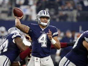 Dallas Cowboys quarterback Dak Prescott throws a pass during the first half of their game against the Washington Redskins on Thursday in Arlington, Texas.