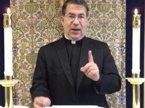 Rev. Frank Pavone appears with an aborted fetus upon an altar in a live video he posted on Facebook Nov. 6, 2016.