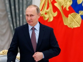 Russian President Vladimir Putin arrives to attend a meeting of the Presidential Council for strategic development in the Kremlin, in Moscow, Russia, Friday, Nov. 25, 2016.