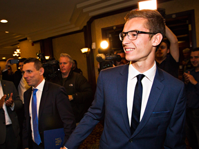 19-year-old Progressive Conservative candidate Sam Oosterhoff, right, with Ontario PC leader Patrick Brown in the background, arrive to celebrate Oosterhoff winning the Niagara-West Glanbrook byelection, Thursday, Nov. 17, 2016