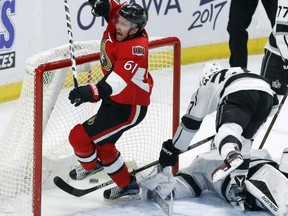 Mark Stone of the Ottawa Senators reacts after scoring the game-winner with just 6.5 seconds remaining to pace the Ottawa Senators past the Los Angeles Kings 2-1 in NHL action Friday night in Ottawa. Goaltender Peter Budaj and defenceman Alec Martinez are down and out on the play.