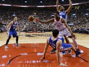 DeMar DeRozan of the Toronto Raptors loses control of the ball after colliding with Philadelphia 76ers Ersan Ilyasova during Monday NBA action at the Air Canada Centre. The Raptors begin a six-game homestand with an impressive 122-95 win.