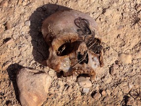 A mass grave containing the remains of members of the Yazidi community killed by ISIL discovered by Kurdish forces near the Iraqi village of Sinuni, in the northwestern Sinjar area on Feb. 3, 2015.