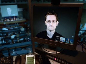 Former intelligence contractor Edward Snowden appears via live video link from Russia on a computer screen during a parliamentary hearing  at the Council of Europe in Strasbourg in 2015