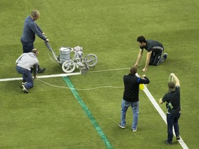 An official paints the lines around the eighteen yard box prior to the MLS Eastern Conference final between the Montreal Impact and Toronto FC at the Olympic Stadium in Montreal, Tuesday, November 22, 2016.