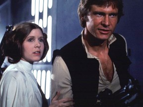 Fisher and Harrison Ford star in the original Star Wars movie shot in 1976.