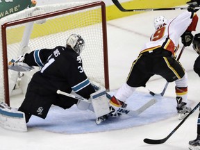 Calgary Flames' rookie Matthew Tkachuk flips a backhander past San Jose Sharks goaltender Martin Jones late in the third period for what proves to be the game-winner in Calgary's 3-2 victory in Thursday NHL action in San Jose. Tkachuk had two goals on the night to pace the win.