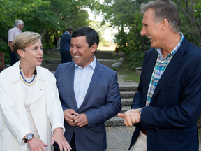 Conservative leadership candidates Kellie Leitch, Michael Chong and Maxime Bernier share a delightful chuckle in a park.