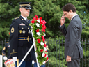 Prime Minister Justin Trudeau does the sign of the cross after laying a wreath at the Tomb of the Unknown Soldier at the Arlington Cemetery on March 11, 2016 in Arlington, Virginia.