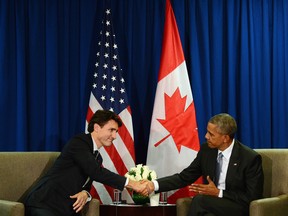 Justin Trudeau takes part in a bilateral meeting with U.S. President Barack Obama at the APEC Summit in Lima, Peru.