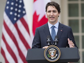 Prime Minister Justin Trudeau speaks at a press conference in the White House rose garden during a state visit on March 10, 2016.