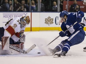 Toronto Maple Leafs forward Mitch Marner (right) dekes out Florida Panthers goaltender James Reimer for a first-period goal in a 6-1 Maple Leafs victory on Nov. 17.
