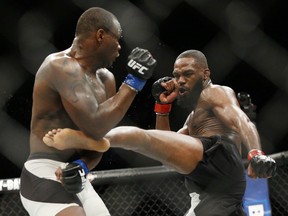 Jon Jones (right) kicks Ovince Saint Preux during an interim light heavyweight championship mixed martial arts bout at UFC 197 in Las Vegas on April 23.