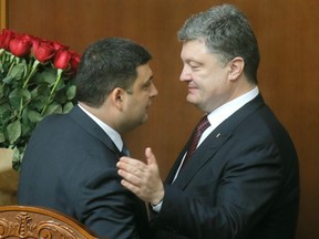Prime Minister Volodymyr Hroisman, left, and President Petro Poroshenko both revealed great personal wealth as they met IMF demands by the Sunday deadline.