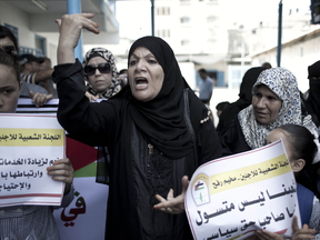 Palestinians in the Gaza Strip protest the reduction of educational programs run by United Nations Relief and Works Agency in 2015.