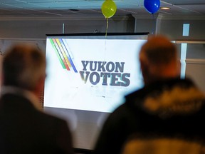 People watch results come in at a Yukon Party venue in Whitehorse during the territorial election on Nov. 7, 2016.