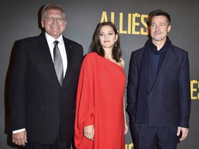 Robert Zemeckis, Marion Cotillard and Brad Pitt attend the Paris premiere of Allied on November 20, 2016 at Cinema UGC Normandie on November 20, 2016 in Paris, France.