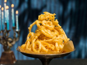 "Also known as jalebi, these crisp fritters, or funnel cakes, were adopted by Iraqi Jews centuries ago as the perfect fried food to celebrate the miracle of Hanukkah," Saltsman writes of zengoula.