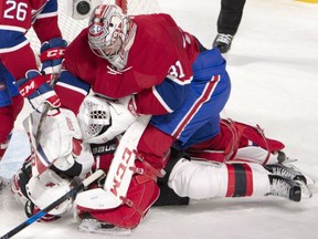 Montreal Canadiens goalie Carey Price punches New Jersey Devils right-winger Kyle Palmieri after the two collided in the crease in the first period Thursday in Montreal. Price remained in the game, making 19 saves in a 5-2 Canadiens win.