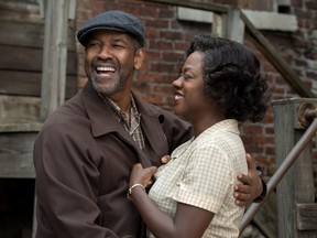 Denzel Washington plays Troy Maxson and Viola Davis plays Rose Maxson in Fences.