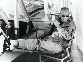 Astronaut John Glenn relaxes aboard the USS Noa after being recovered from the Atlantic near Grand Turk Island after his historic Mercury flight.   The Noa picked him up 21 minutes after impact.