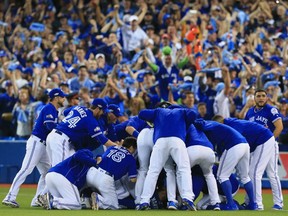 Toronto Blue Jays players celebrate their ALDS sweep of the Texas Rangers on Oct. 9.
