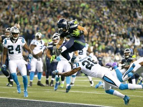 Seattle Seahawks running back Thomas Rawls hurdles into the end zone in a 40-7 victory over the Carolina Panthers Sunday night.