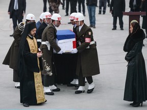 The flag-wrapped coffin of late Russian Ambassador to Turkey Andrei Karlov is carried to a plane by Turkish soldiers during a ceremony at Esenboga airport on December 20, 2016 in Ankara
