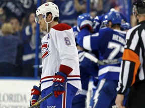 Shea Weber of the Montreal Canadiens is downcast as members of the Tampa Bay Lightning celebrate a goal during the third period at Amalie Arena in Tampa, Fla., on Wednesday night.