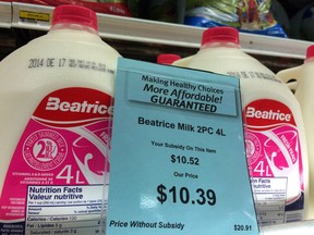 A price tag lists the price and subsidy of a four-litre jug of milk at a grocery store in Iqaluit, Nunavut in 2014. A researcher has found that a federal subsidy intended to reduce astronomical food prices for northern families has resulted in stale-dated, unreliable food on store shelves without making grocery bills more affordable.