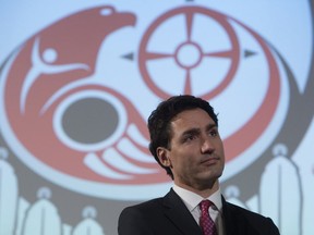 Canadian Prime Minister Justin Trudeau listens to speakers during a ceremony honouring Tragically Hip frontman Gord Downie at the AFN Special Chiefs assembly in Gatineau, Que., Tuesday, December 6, 2016. THE CANADIAN PRESS/Adrian Wyld